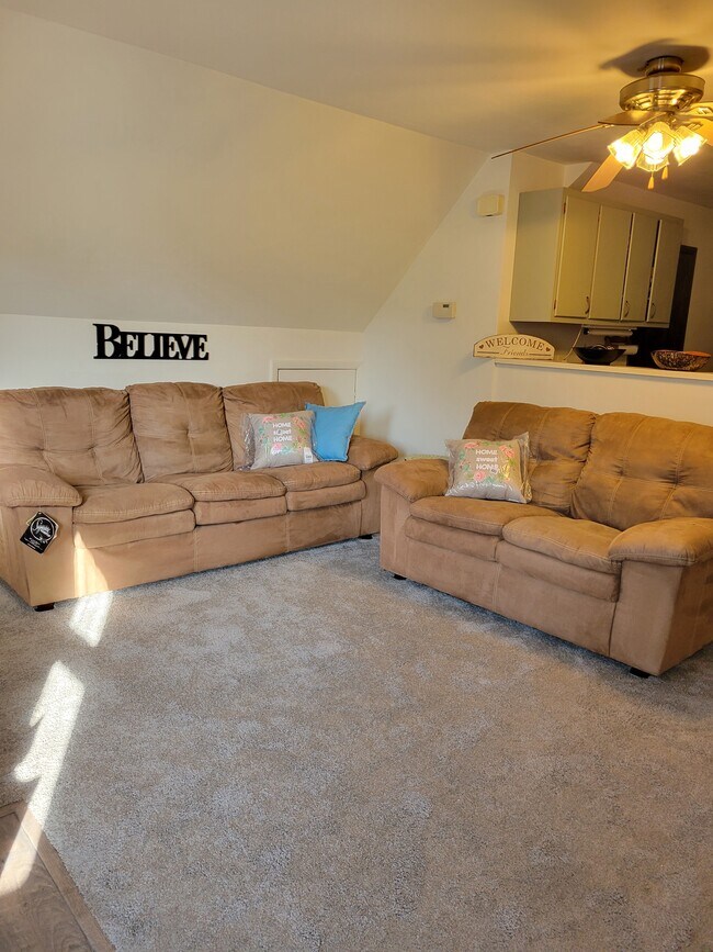 Newly carpeted living room and furniture provided - 2215 N 70th St