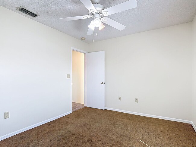 Building Photo - Spanish-Style 3 Bedroom, 2.5 Bath Mediterranean Rooftop Townhouse – Basic Cable & Wi-Fi Included!