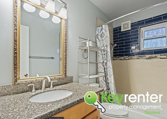 Building Photo - Updated 4-Bedroom, 2-Bath Tacoma Home for Rent Near Tacoma Community College and 6th Ave!