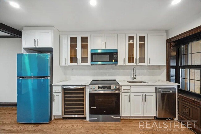 Building Photo - Timelessly Renovated Historic Triplex with...