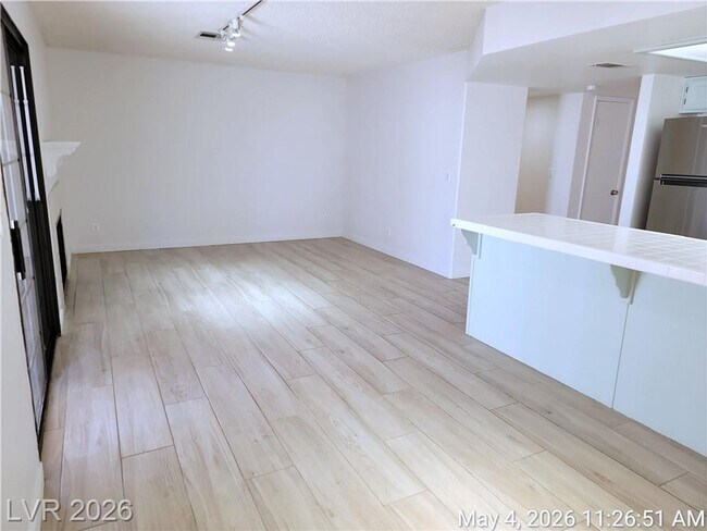 Building Photo - The Lakes Home with No Carpet, Fireplace & Covered Patio