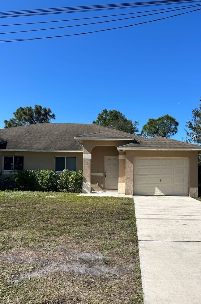 Building Photo - Charming 3BR/2BA Lehigh Acres Duplex with 1-Car Garage | Lawn Care & Salt Service Included