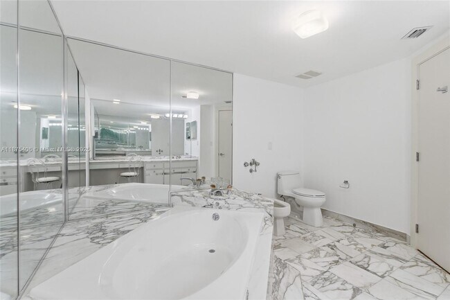 Building Photo - 10155 Collins Ave