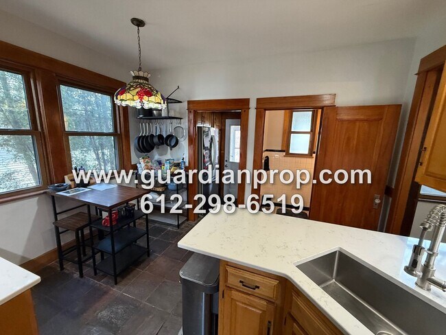 Building Photo - Merriam Park House Available May 1st, Updated Kitchen, Office, Fenced Yard, 2 Car Garage