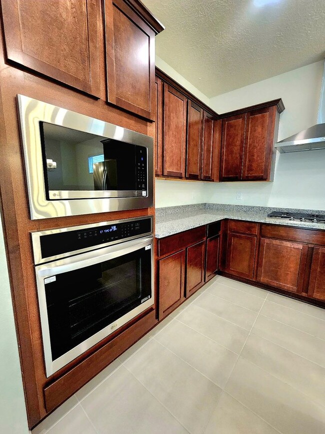 Building Photo - Brand-New Construction Townhome – Never Li...