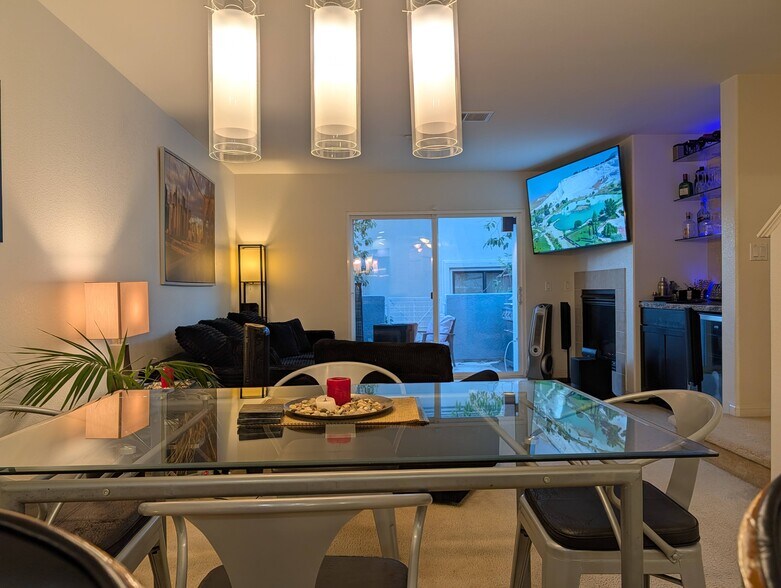 View of dining area facing living room and balcony - 3542 Shoreline Bluff Lane