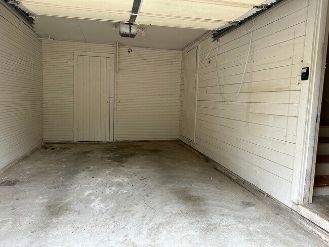 Garage interior with storage closet and auto door opener - 314 E 7th St