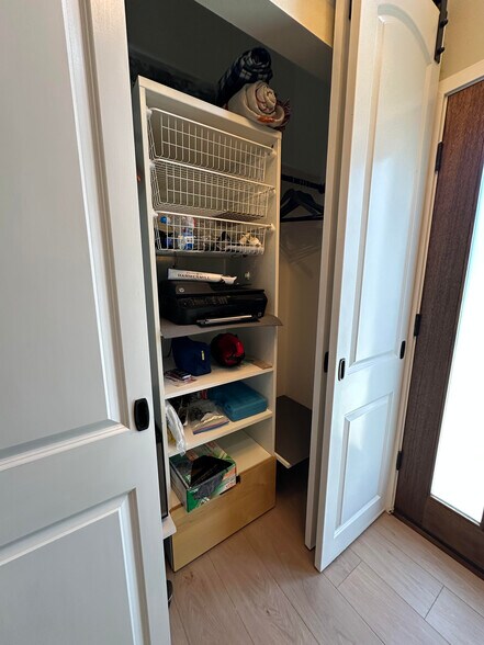 Storage near front door behind barn-style doors - 1490 Ash St