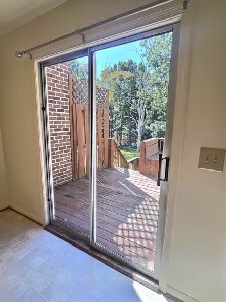 Light filled view of deck from kitchen and eat-in dining area - 69 Court Pl