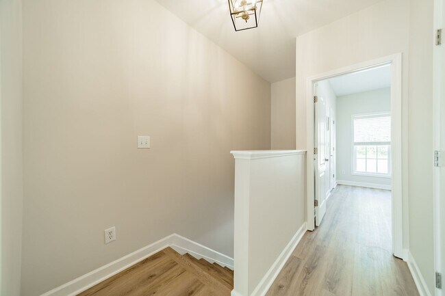 Building Photo - UPGRADES! Two Bedroom Townhouse - Six Mont...