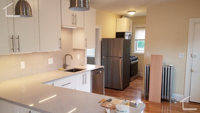 Building Photo - Large, newly renovated 3 bed near the Green Line and Commuter Rail!