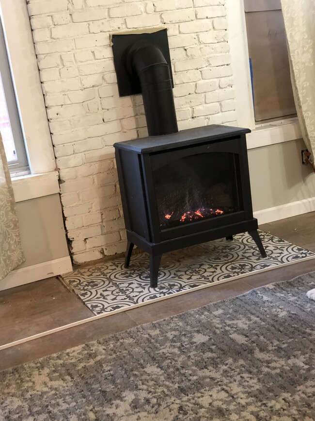 Warm, energy efficient gas heating stove - 764 Eastern Ave