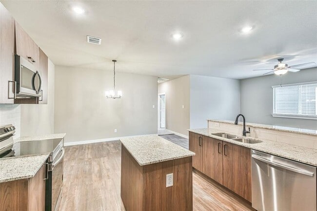 Building Photo - Modern 3-Bedroom Duplex with Granite Counters, Private Yard, and Prime Location