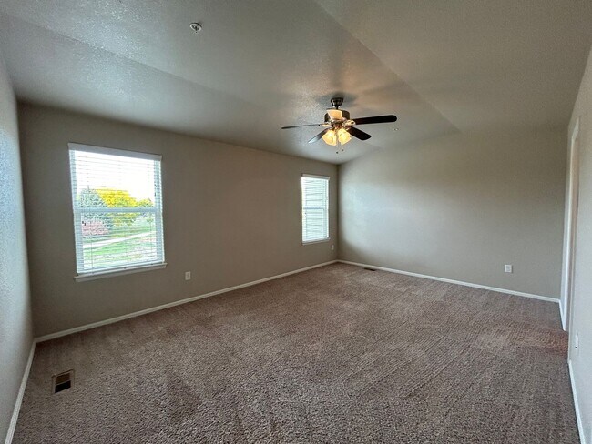 Building Photo - $500 Off First Month Of Rent! Modern 3BR Townhome with Fenced Yard & Garage