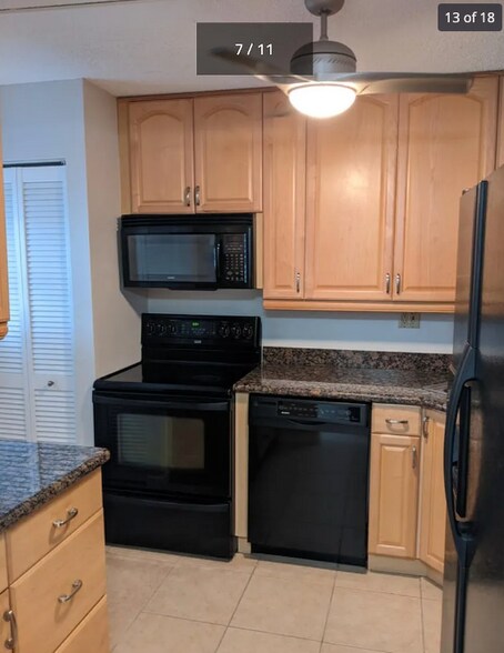 Kitchen with new water heater and dishwasher - 4501 NE 21st Ave