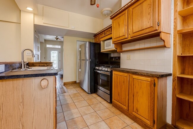 Building Photo - AVAILABLE June 2026 - Beautiful 4 Bedroom, 2 Bath Home w/ Front Porch Swing!