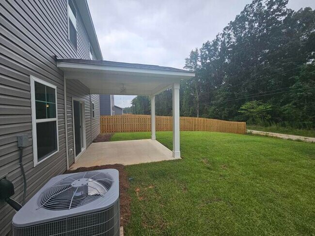 Building Photo - 1 year old 5 bedroom home w community pool!