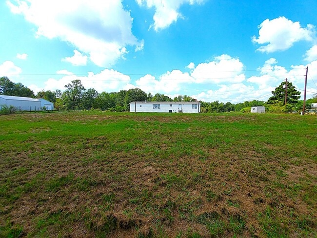Building Photo - Spacious 4 bedroom with 3 FULL bathrooms nestled on 2 acres! MUST SEE!!!