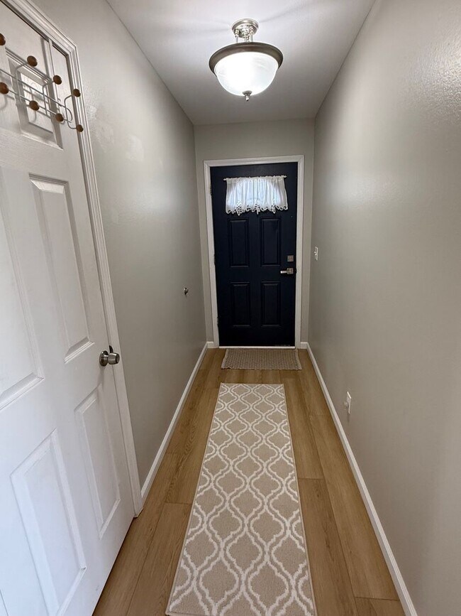 Building Photo - Updated 3BR Home with Luxury Vinyl Plank Flooring Throughout & Spacious Yard