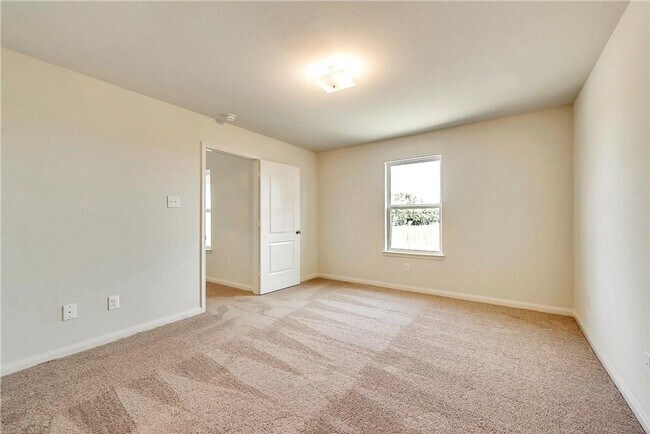 Building Photo - This lovely 4 bedroom home features a large family room with lots of light.