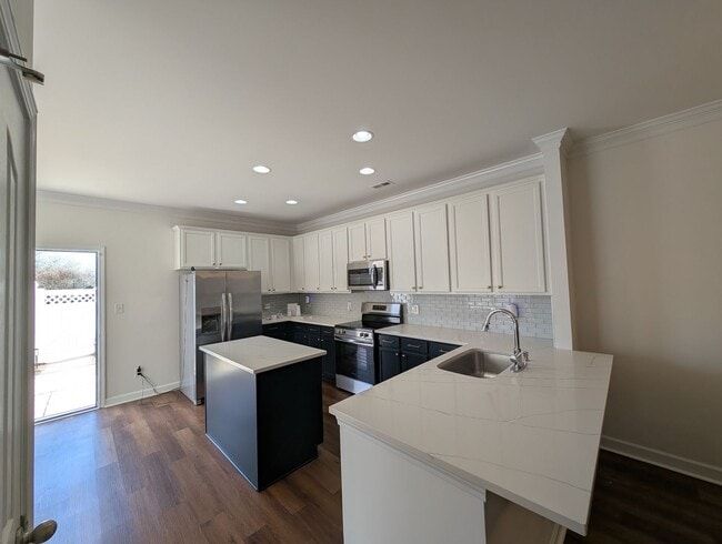 Building Photo - Pristine End Unit Townhome located in the Prosperity Place community!