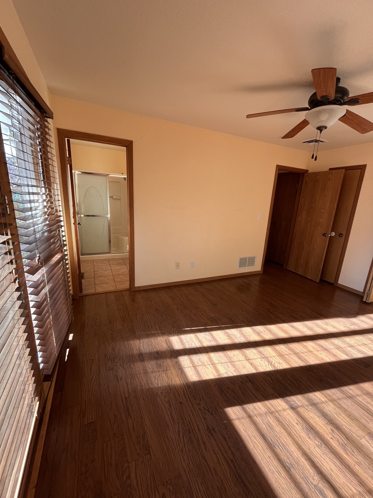 Primary bedroom facing hall and primary bathroom - 507 Chipeta Trl