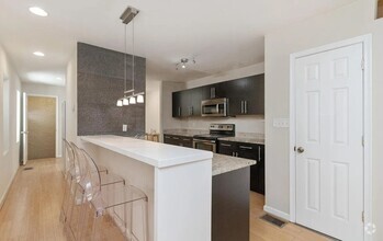 Building Photo - Spacious 4-Bedroom Townhome Near Johns Hop...