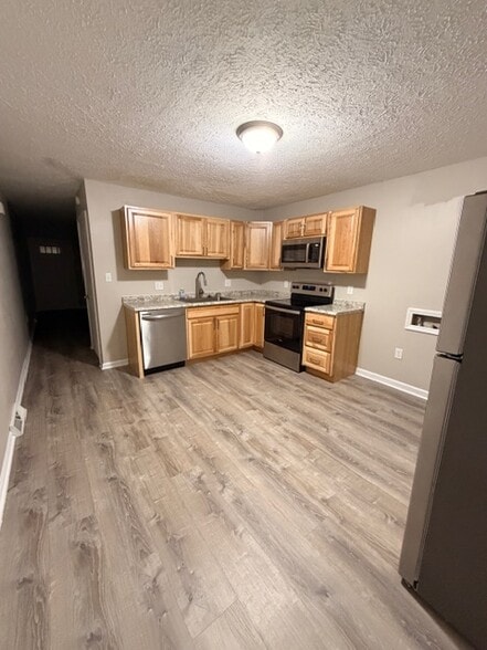 Kitchen - Brand New Cabinets and Flooring and New Microwave - 3203 Island Rd