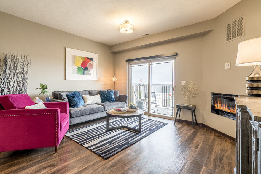 Our layouts feature hardwood-style floors, modern fireplaces, and balconies and patios. - 360 at Jordan West