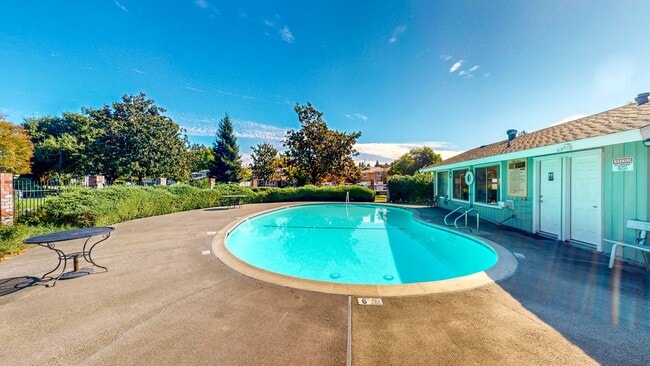 Building Photo - 2 story 2 bedroom 1 bath condo with covered parking, private storage and community pool!