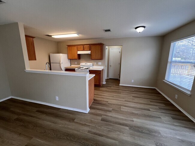 Building Photo - Generous Outdoor Space & Lawn Care Included!