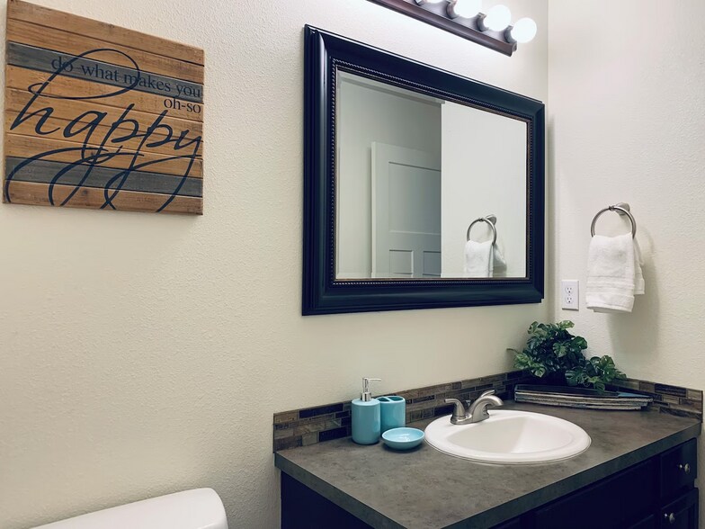 2 full baths upstairs, 1/2 bath downstairs. - 1200 Olney Ave SE