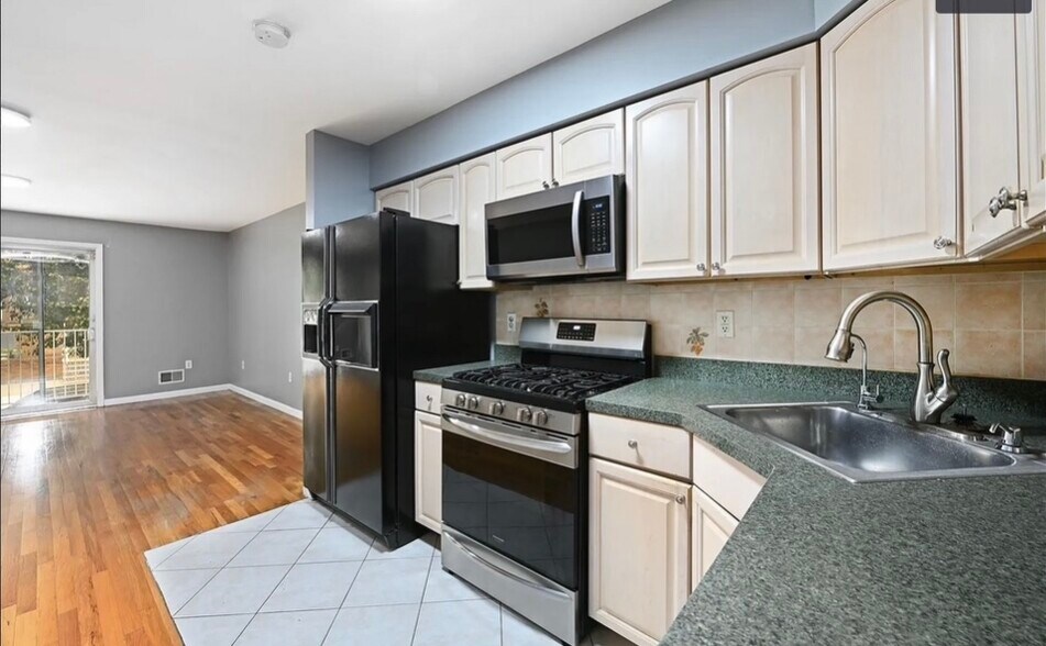 Kitchen, new fridge - 216 Angelique St