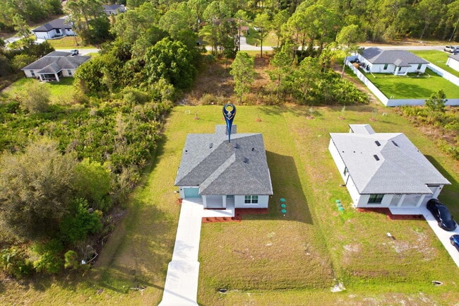 Building Photo - Brand New 4-Bedroom Gem with 2 Full Baths on Large Lot in Lehigh Acres – A Perfect Family Haven!