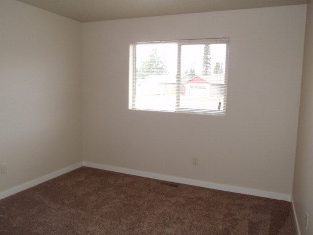 Building Photo - Newer house with attached garage. Half mon...