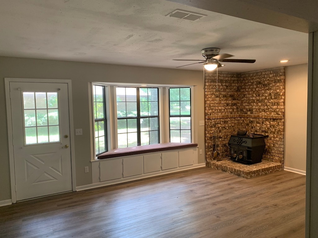 Den with original fireplace, bay windows and seat. - 1903 Ginnett Rd