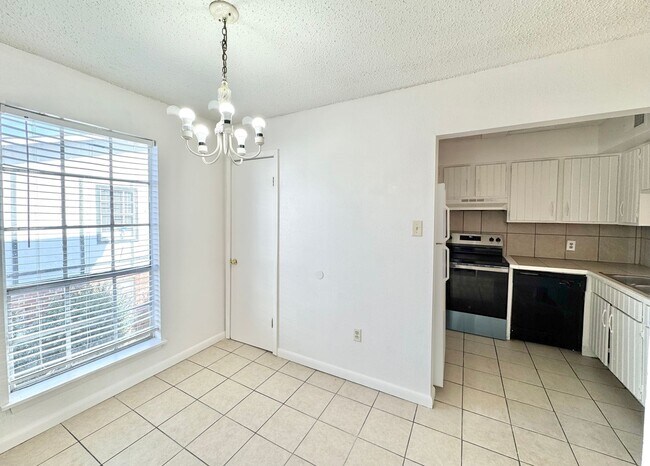 Building Photo - 2 Bed, 1.5 Bath Condo with Pool & Carport ...