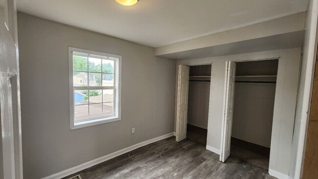 Building Photo - Corner 1st and 2nd flr. unit with central ...