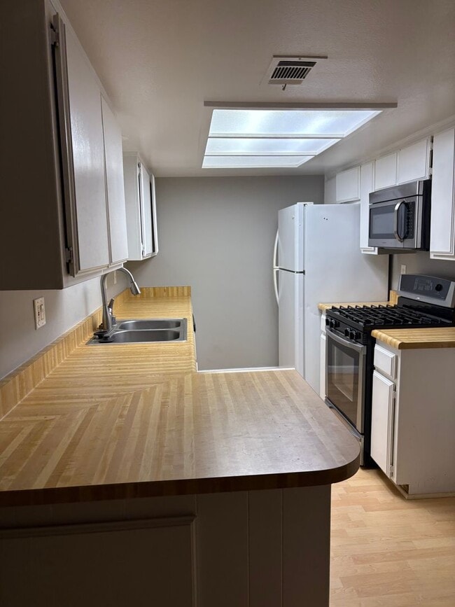 Building Photo - Updated Two Bedroom, 1.5 Bath Condo w/Fire...