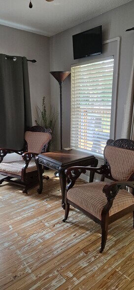 reading area- antique chairs - 6542 Sherry Ln
