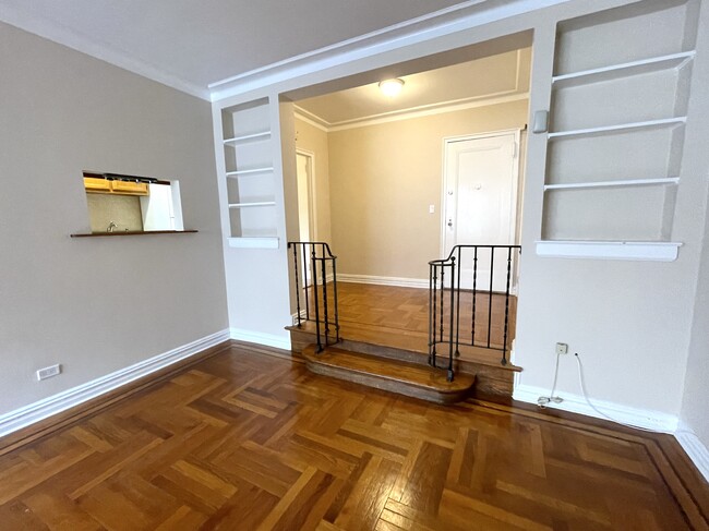 View towards built in bookcases and pass through window to kitchen - 210 Martine Ave