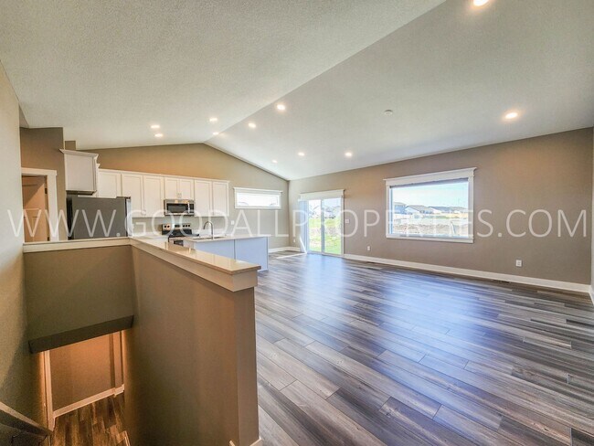 Building Photo - Spacious Waukee Ranch | 4 Bedrooms | 3-Car Garage | Finished Basement