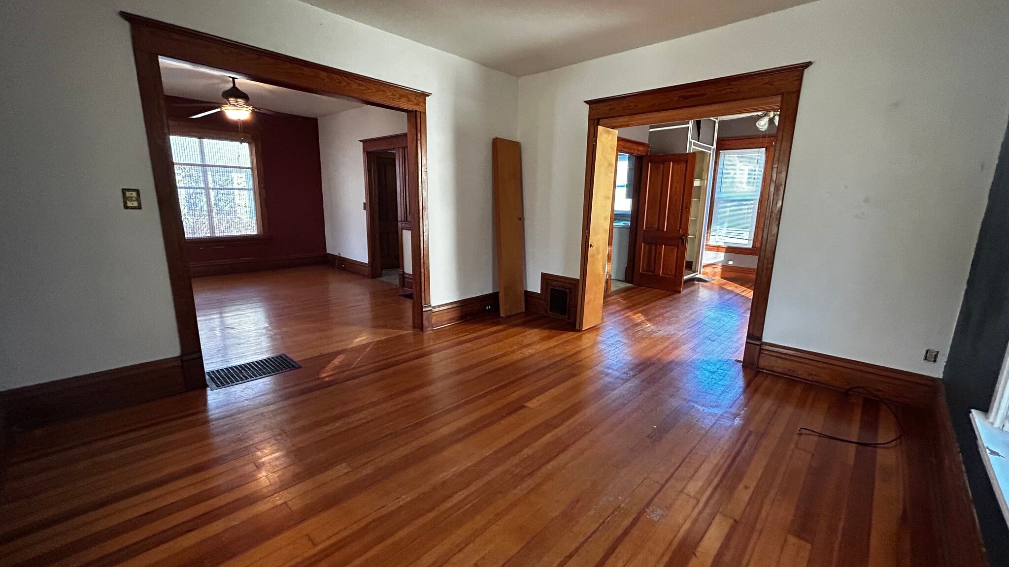 Living room (dining room left; bedroom right) - 509 E Maple St