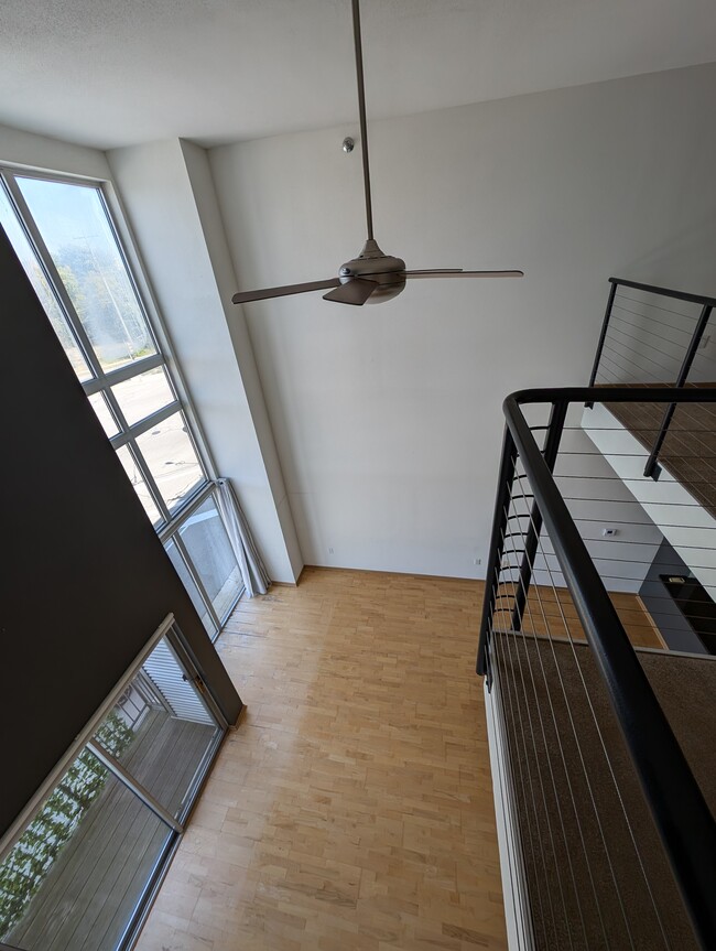 Looking over the loft railing down to the living room - 2121 S Kinnickinnic Ave