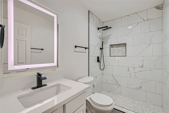 Building Photo - QUALITY DESIGNER Remodeled Condo in a Guar...
