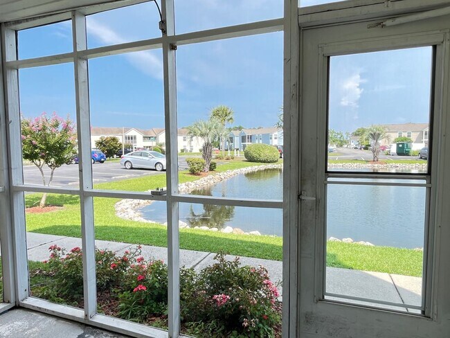 Building Photo - First Floor, Unfurnished, 3 Bedroom, 2 Bath Condo with Screened-in Back Patio!