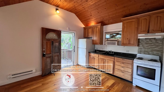 Building Photo - Quaint cottage with hardwood floors, private entrance and patio, surrounded by lush gardens!