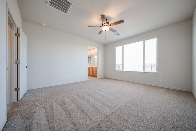 Building Photo - New 4 Bedroom + Den Home in Asante Community