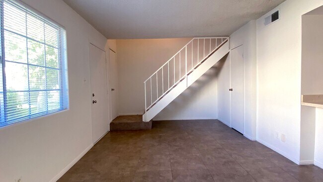 Building Photo - Great 3 bedroom and 1.5 bath townhouse with a small yard and 2 car garage.