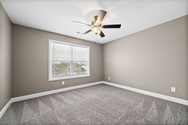 Building Photo - Pet Friendly Three Bedroom with Bonus!